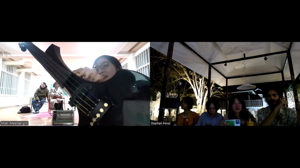 zoom splitscreen. miaki holds the Cantini close to the camera while stephan and his audience look on